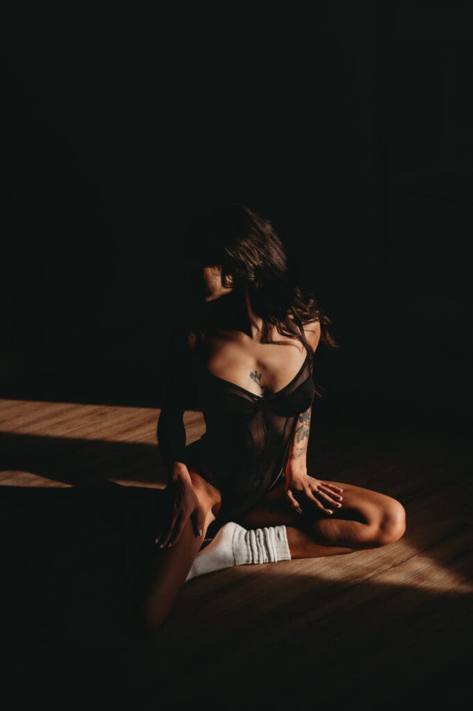 Client modeling a bodysuit as part of boudoir lingerie tips for every body type